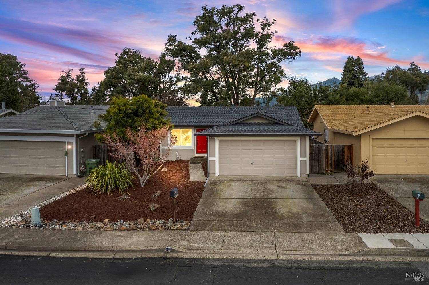 1328 Garmont Court Rohnert Park, CA 94928 - Photo 1 of 1 front view of a house with a yard