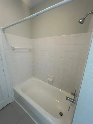 a white toilet sitting next to a small sink