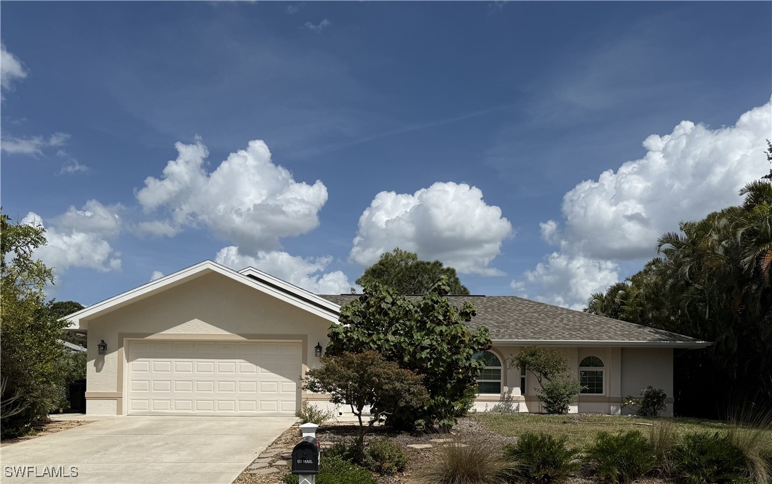 18249 Oak Road Fort Myers, FL 33967 - Photo 1 of 16 a front view of a house with garden