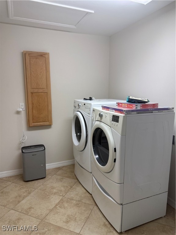 18249 Oak Road Fort Myers, FL 33967 - Photo 15 of 16 a utility room with dryer and washer