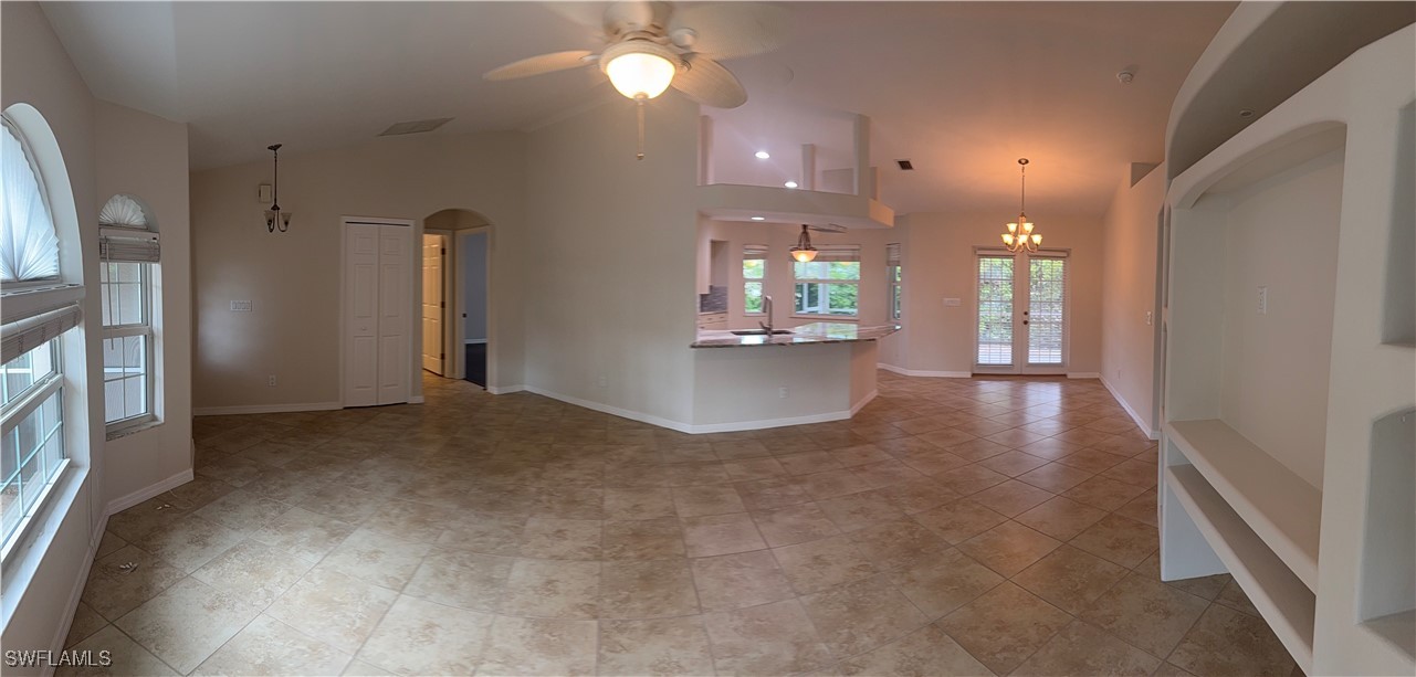18249 Oak Road Fort Myers, FL 33967 - Photo 9 of 16 a view of an empty room with kitchen and a window
