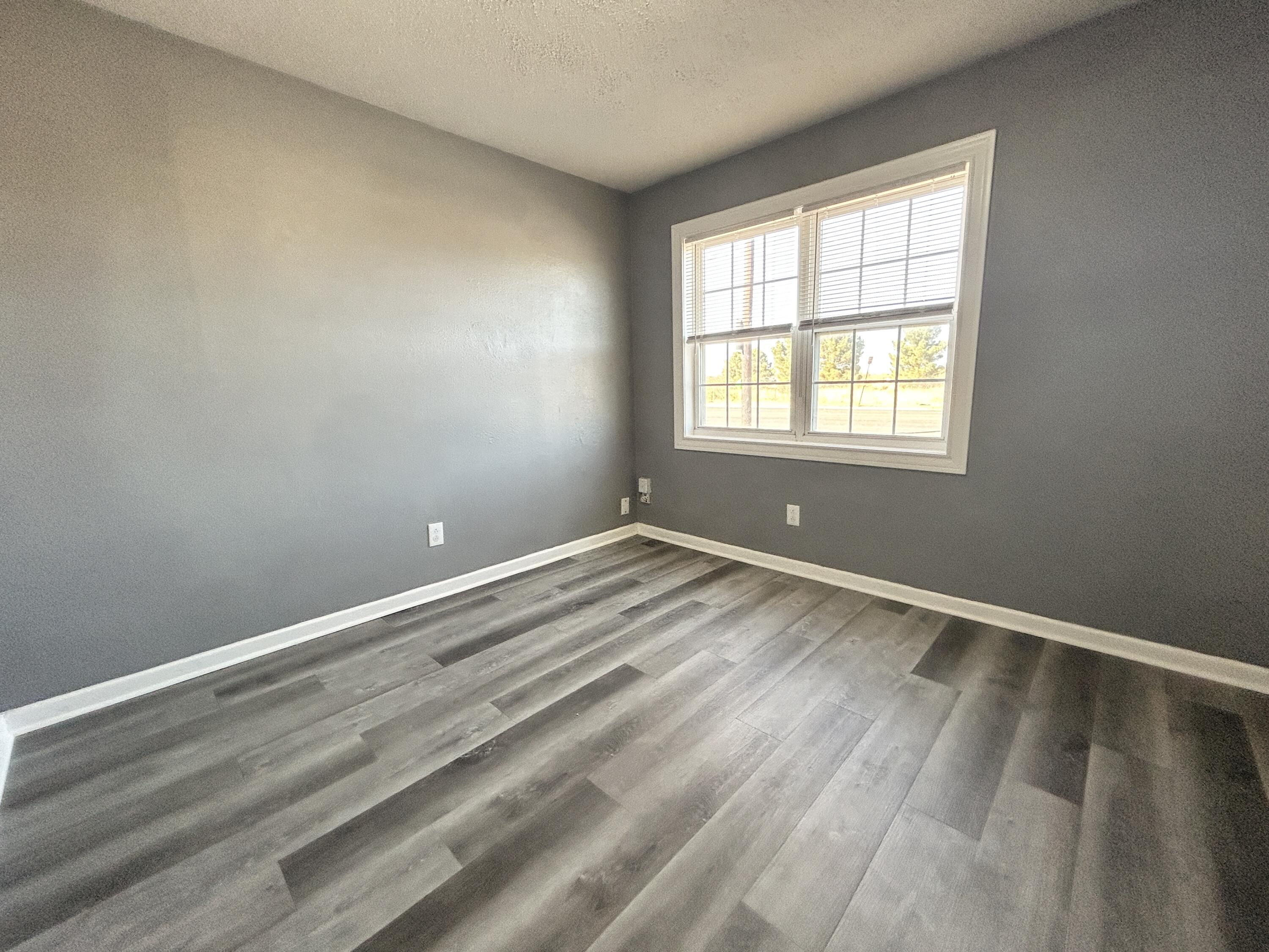 5533 34th Street, Unit A Lubbock, TX 79407 - Photo 7 of 12 a view of room with window
