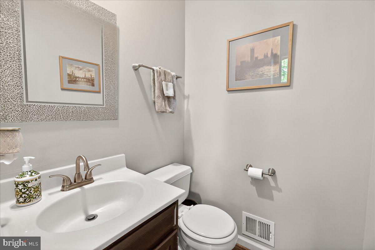 10490 Lakeridge Court New Market, MD 21774 - Photo 14 of 79 a bathroom with a sink mirror and toilet