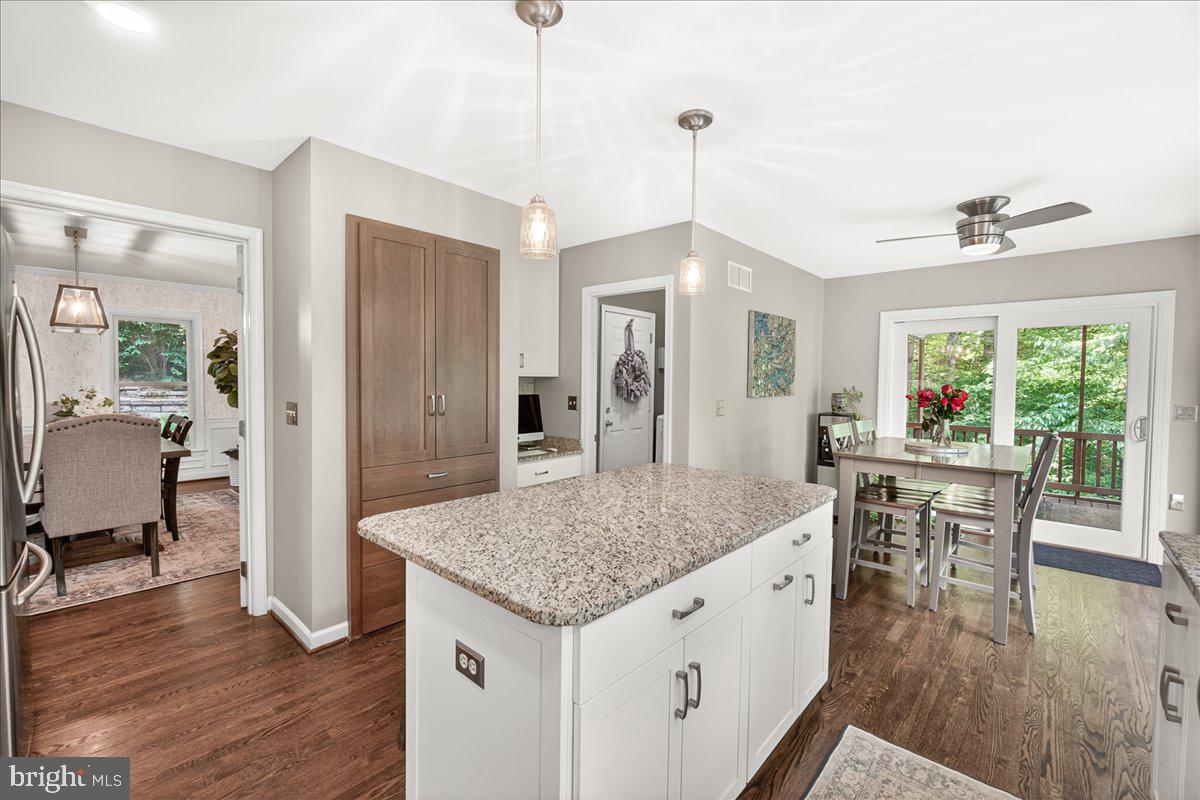10490 Lakeridge Court New Market, MD 21774 - Photo 16 of 79 a view of living room with granite countertop furniture and wooden floor