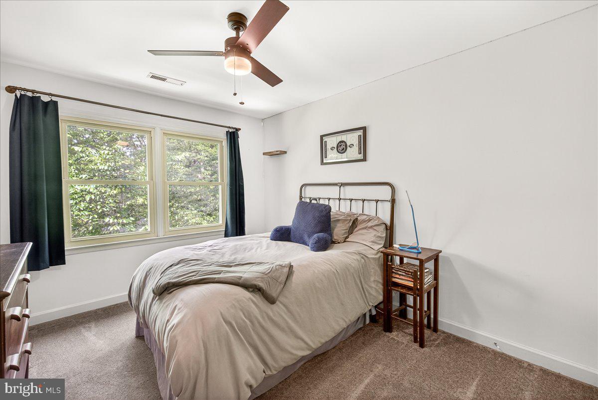 10490 Lakeridge Court New Market, MD 21774 - Photo 28 of 79 a bedroom with a bed and a window