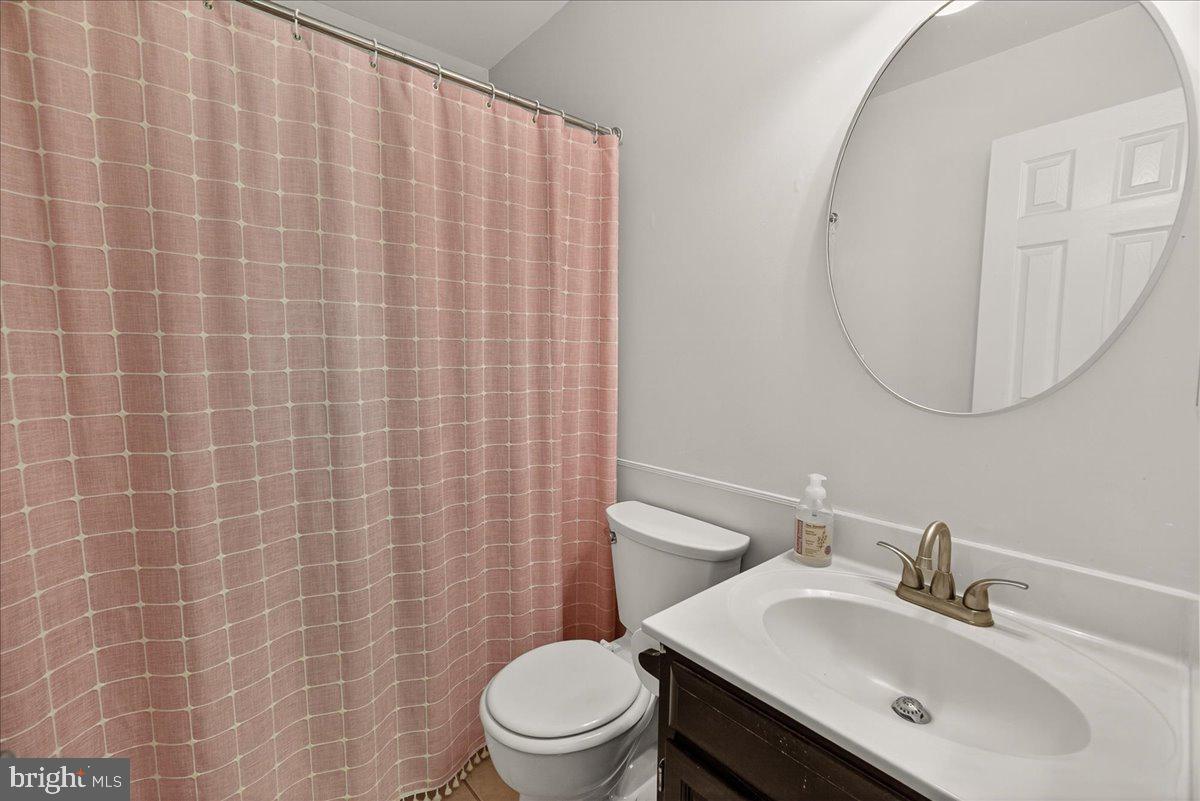 10490 Lakeridge Court New Market, MD 21774 - Photo 29 of 79 a bathroom with a sink a toilet and mirror