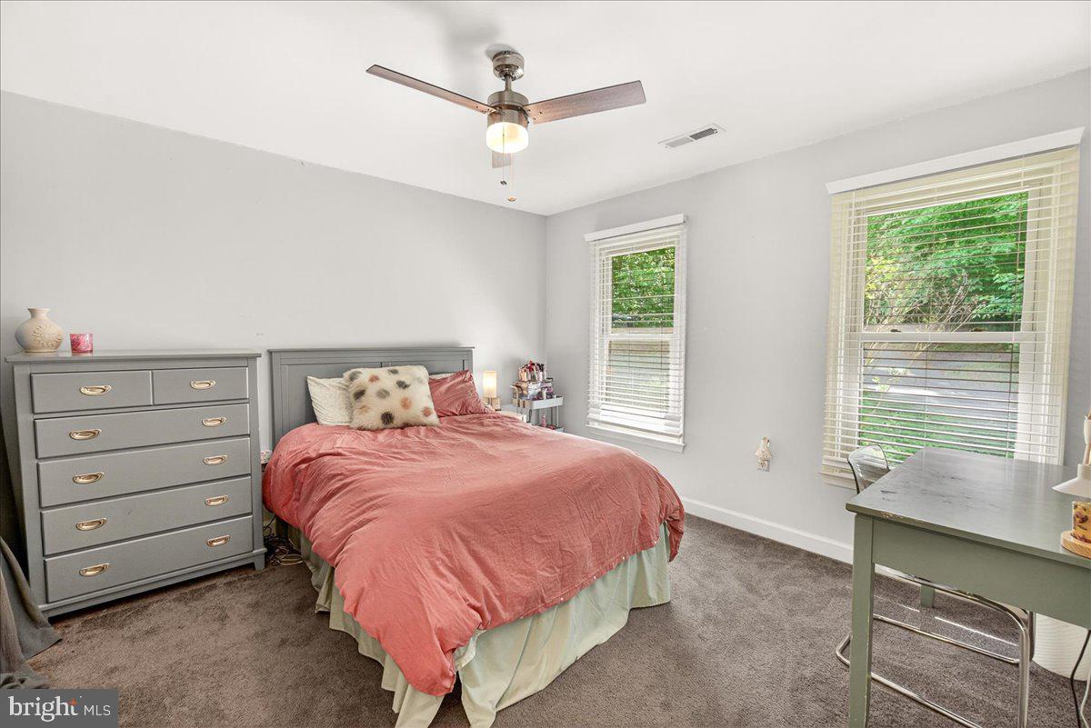 10490 Lakeridge Court New Market, MD 21774 - Photo 30 of 79 a bedroom with a bed a window and a dresser