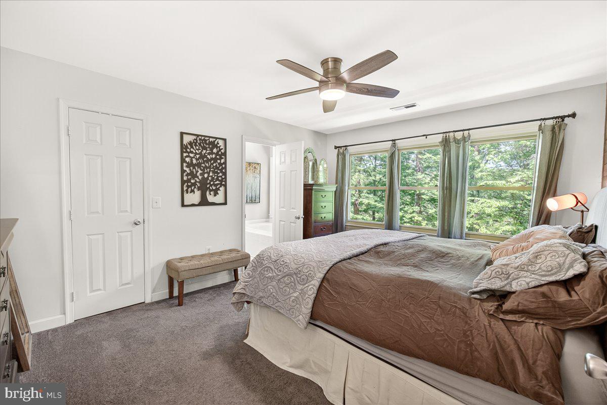 10490 Lakeridge Court New Market, MD 21774 - Photo 31 of 79 a bed sitting in a spacious bedroom next to a window