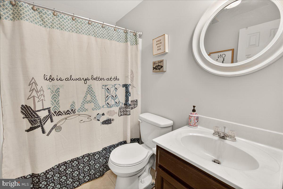 10490 Lakeridge Court New Market, MD 21774 - Photo 41 of 79 a bathroom with a sink and a mirror
