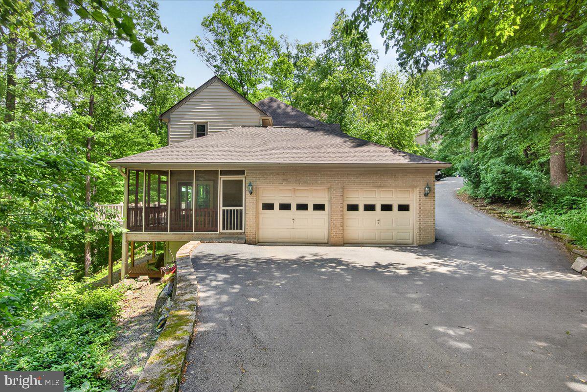 10490 Lakeridge Court New Market, MD 21774 - Photo 6 of 79 a front view of a house with a garden and yard