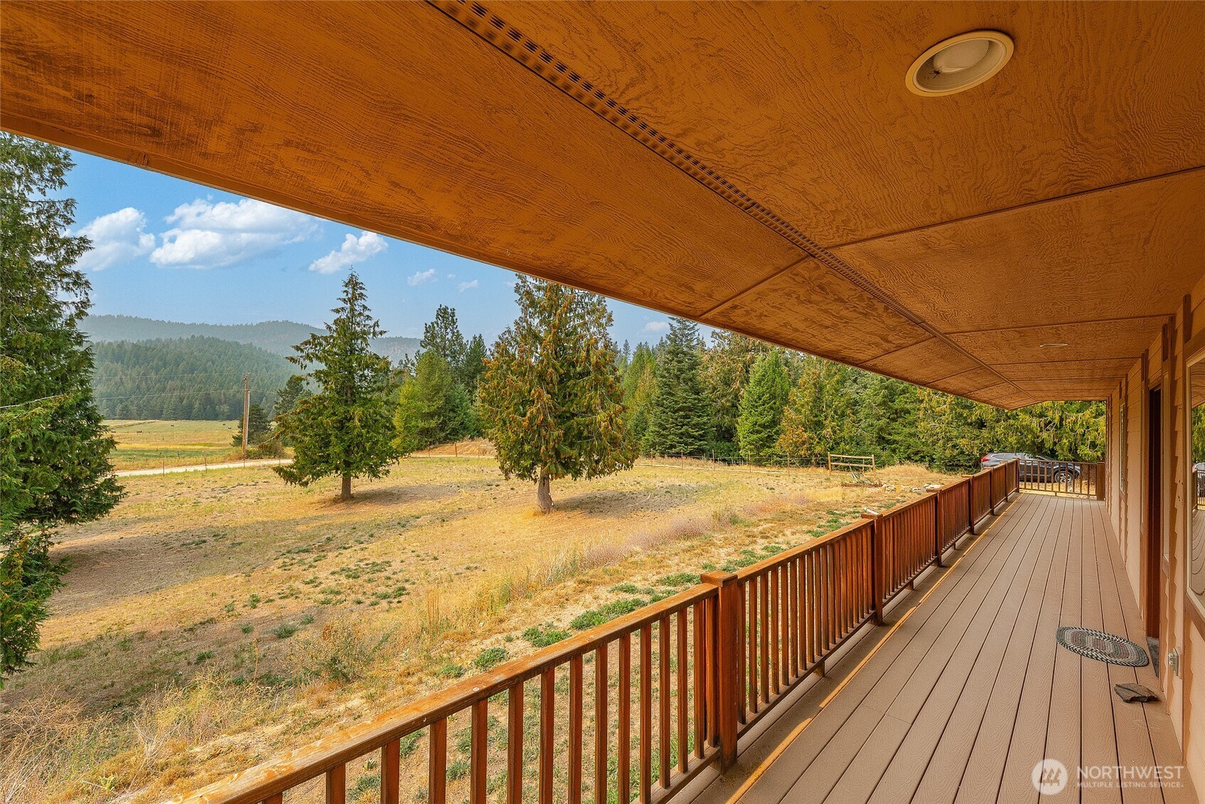 5070 Redman Road Clayton, WA 99110 - Photo 5 of 33 a view of a balcony with trees