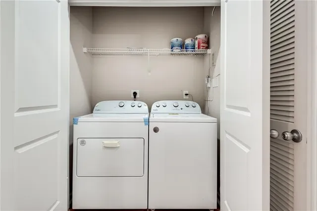 a utility room with dryer and washer