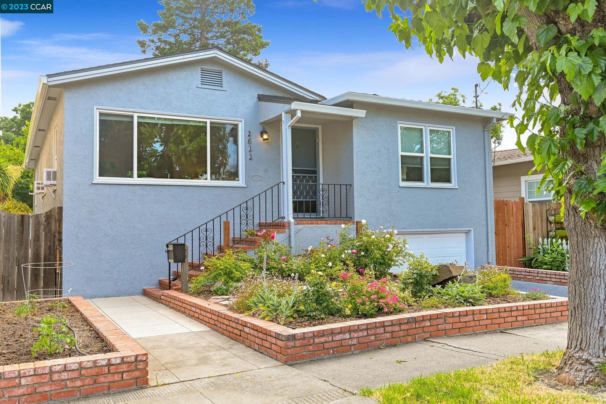 1611 Castro Street Martinez, CA 94553 - Photo 1 of 1 front view of a house with a yard