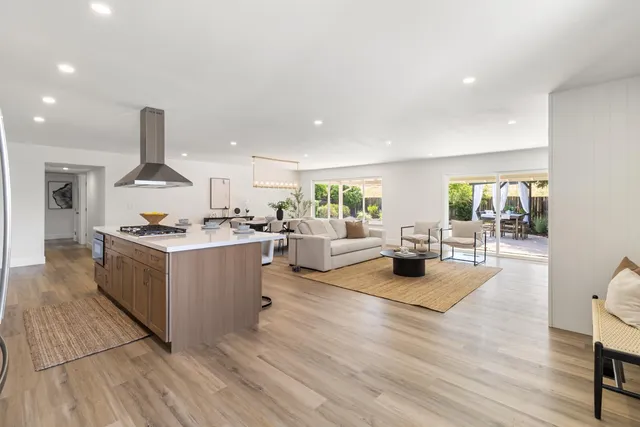 a kitchen with cabinets appliances and a sink