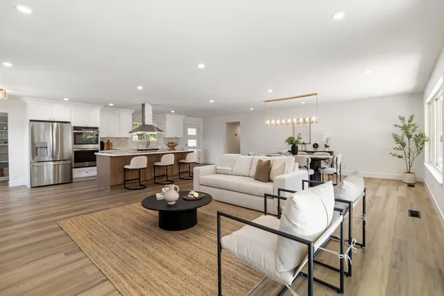 a kitchen with stainless steel appliances a refrigerator and cabinets