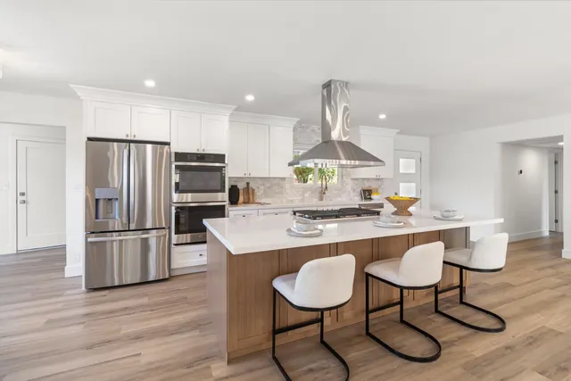 a bedroom with a bed and a couch