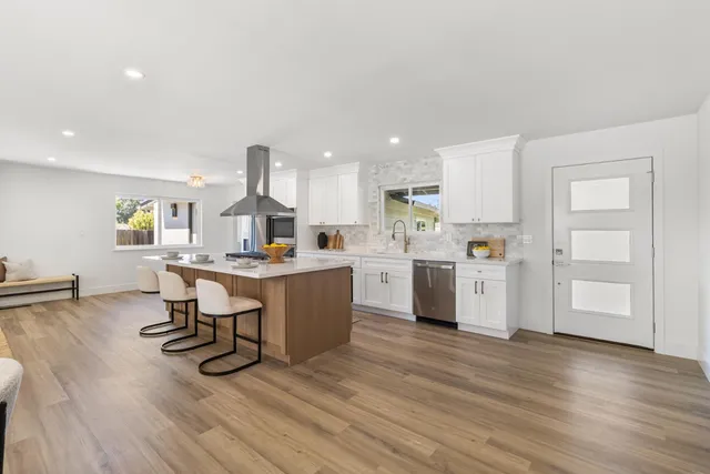 a bathroom with a double vanity sink mirror double and shower