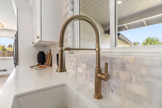 a bathroom with a sink double vanity granite toilet tub and shower