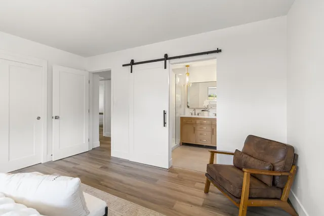 a backyard of a house with table and chairs