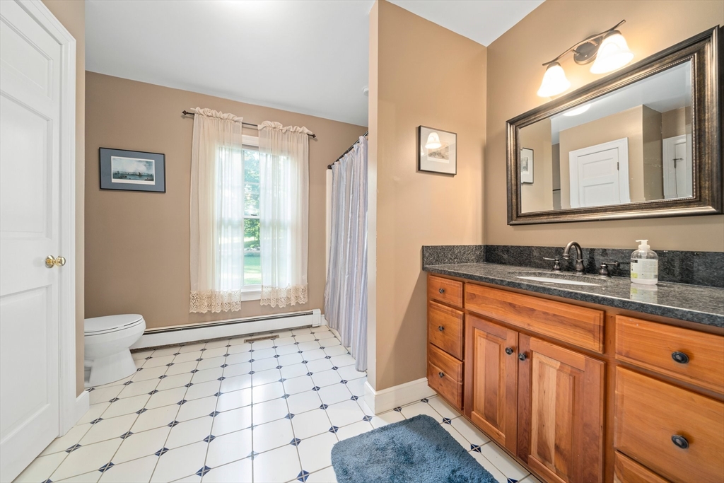 155 Pine Street Medfield, MA 02052 - Photo 11 of 40 a bathroom with a sink a toilet a window and vanity