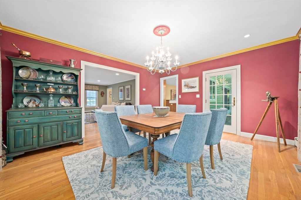 155 Pine Street Medfield, MA 02052 - Photo 13 of 40 a view of a dining room with furniture and chandelier
