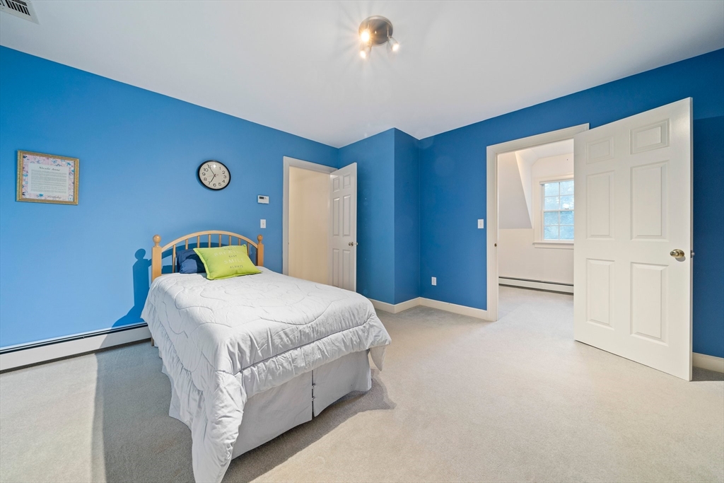 155 Pine Street Medfield, MA 02052 - Photo 22 of 40 a bedroom with a bed and a cabinets