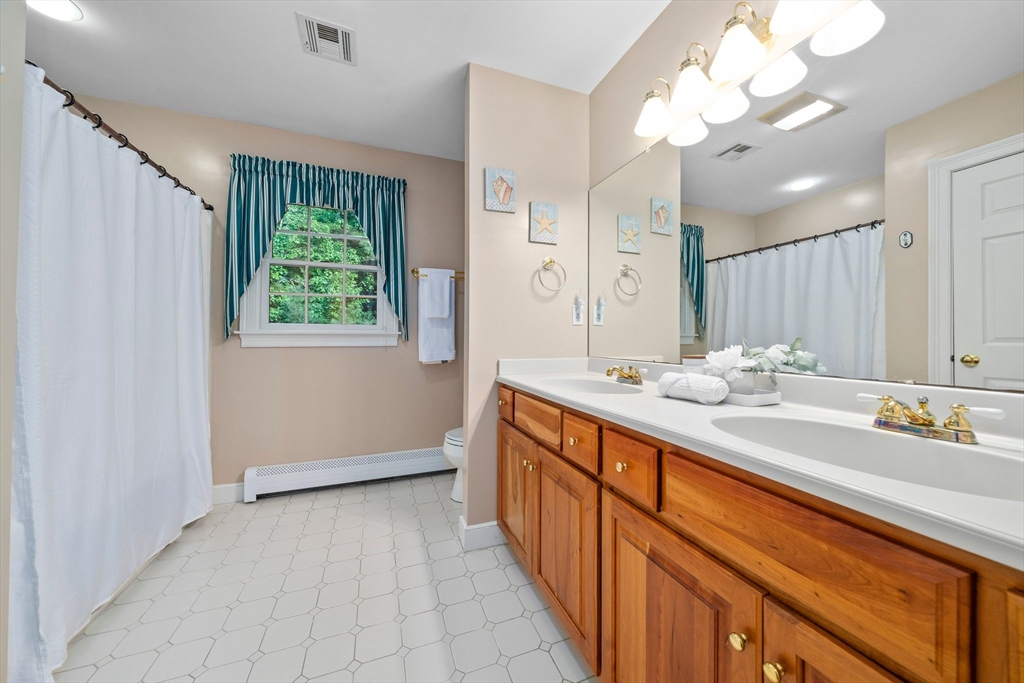 155 Pine Street Medfield, MA 02052 - Photo 23 of 40 a spacious bathroom with a double vanity sink mirror and