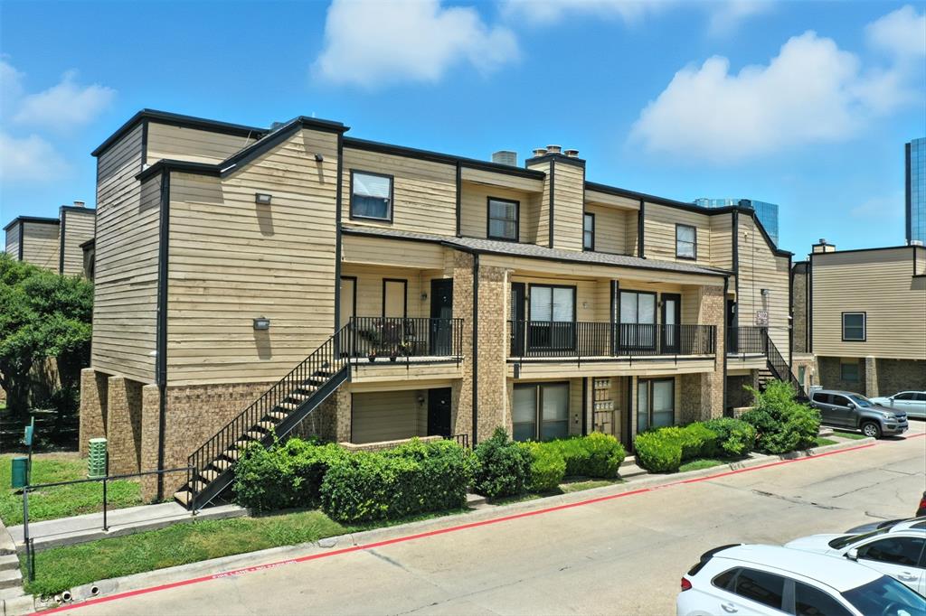 3022 Forest Lane, Unit 308 Dallas, TX 75234 - Photo 16 of 21 a front view of a house with a yard