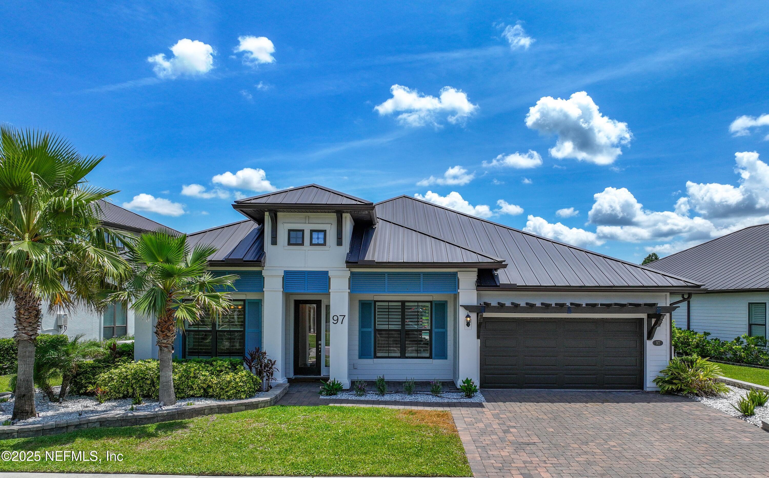 97 Marquesa Circle St. Johns, FL 32259 - Photo 1 of 86 a view of a house with a large windows and a fountain