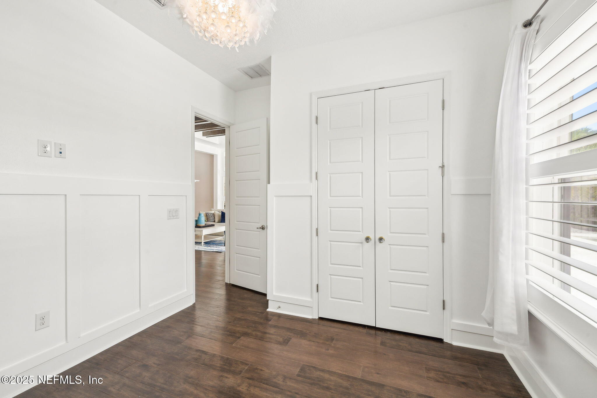 97 Marquesa Circle St. Johns, FL 32259 - Photo 39 of 86 an empty room with wooden floor cabinet and windows