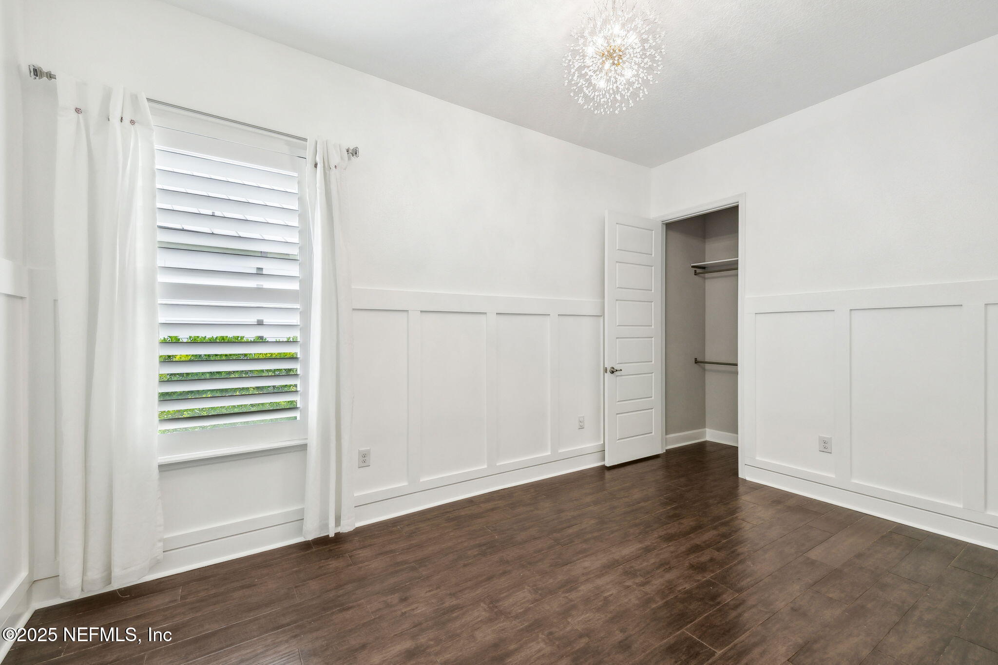 97 Marquesa Circle St. Johns, FL 32259 - Photo 40 of 86 an empty room with wooden floor cabinet and windows