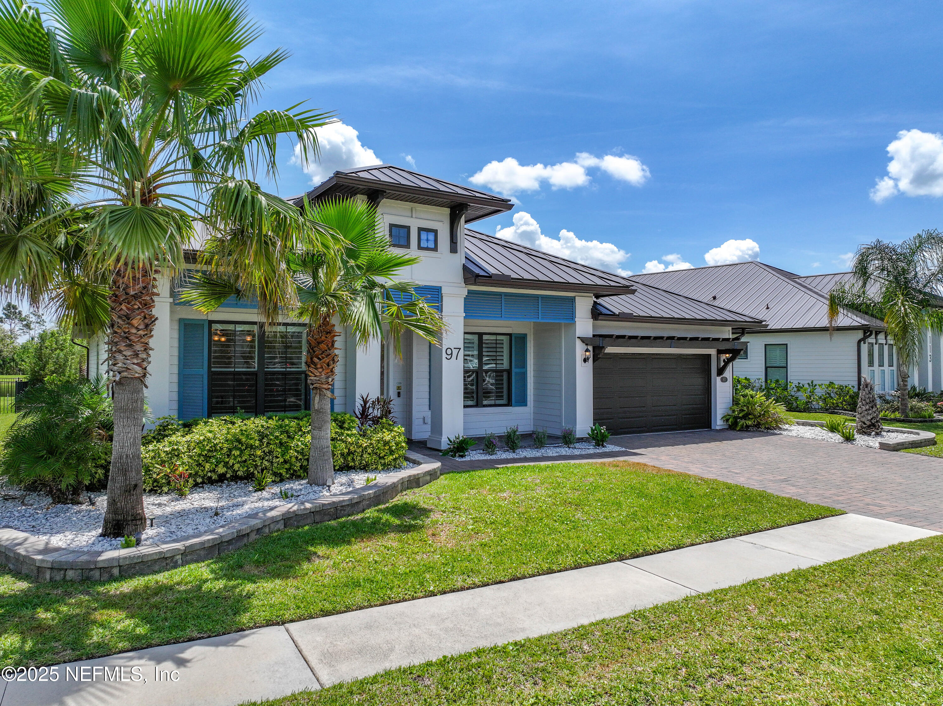 97 Marquesa Circle St. Johns, FL 32259 - Photo 54 of 86 a front view of a house with a yard and garage