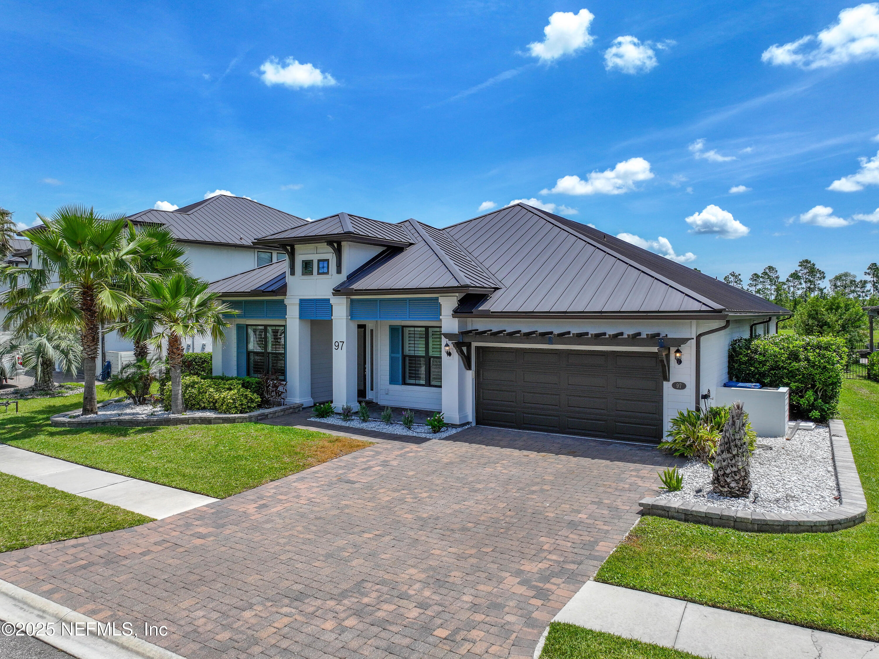 97 Marquesa Circle St. Johns, FL 32259 - Photo 55 of 86 a front view of a house with a garden and yard
