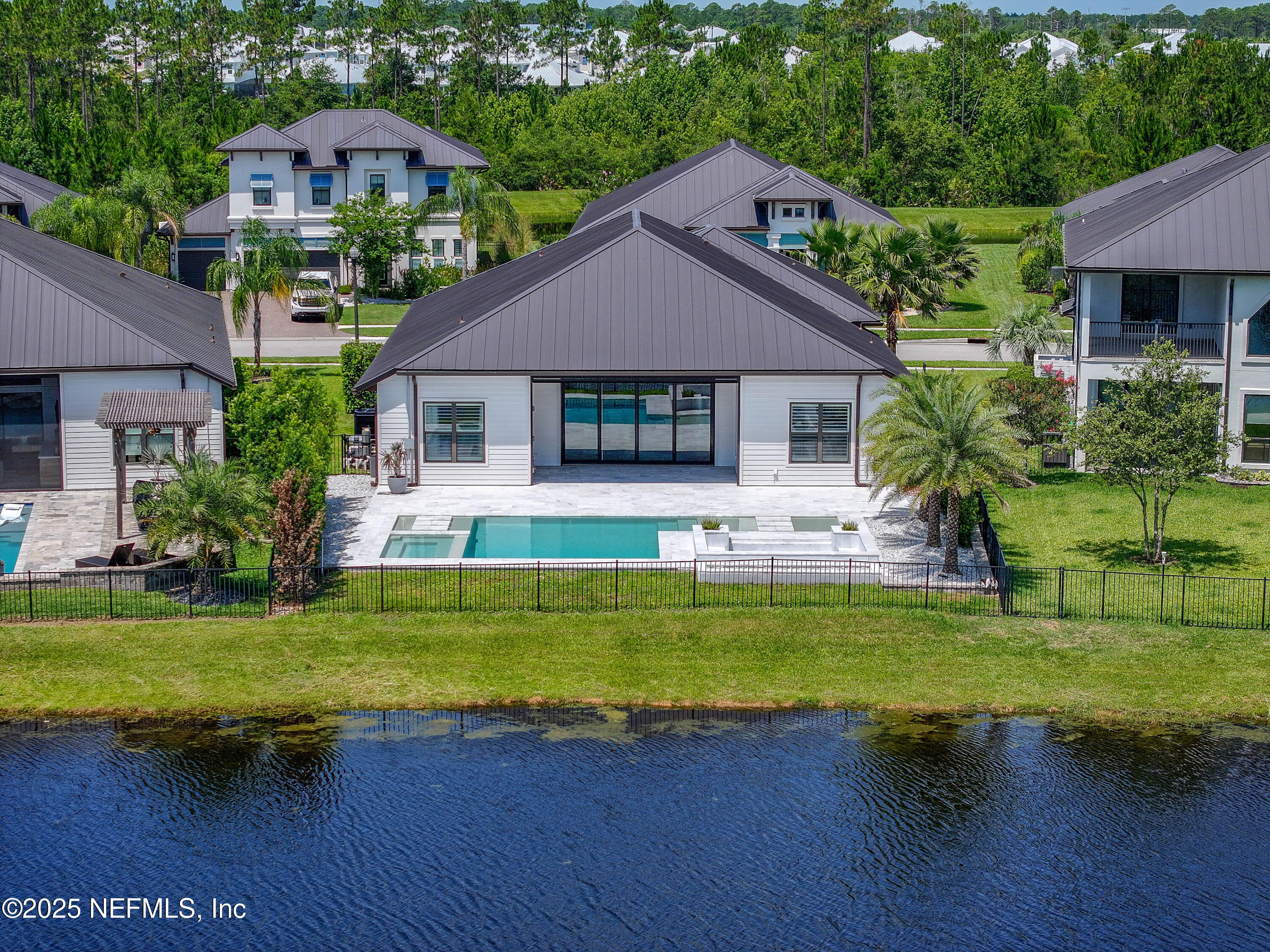 97 Marquesa Circle St. Johns, FL 32259 - Photo 56 of 86 a front view of a house with a yard table and chairs