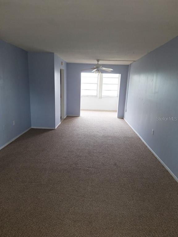 9940 47th Avenue North, Unit 320 St. Petersburg, FL 33708 - Photo 15 of 23 a view of empty room with windows