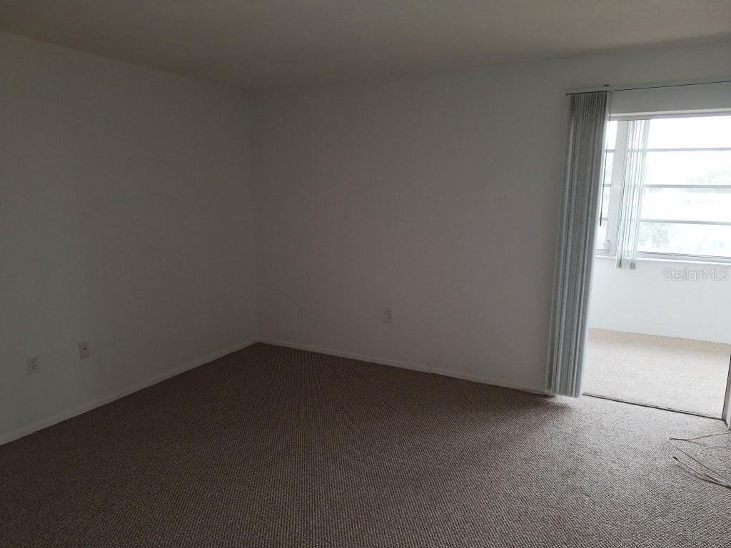 9940 47th Avenue North, Unit 320 St. Petersburg, FL 33708 - Photo 20 of 23 an empty room with a window