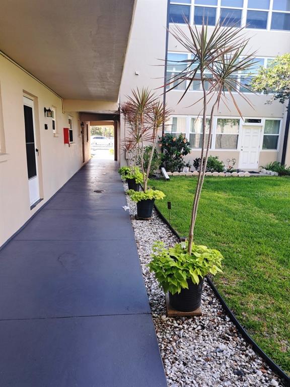 9940 47th Avenue North, Unit 320 St. Petersburg, FL 33708 - Photo 2 of 23 a view of outdoor space and garden view