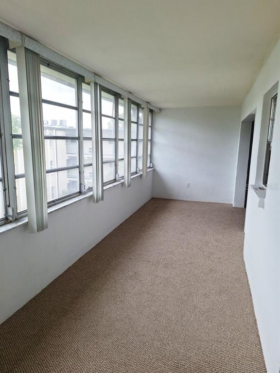9940 47th Avenue North, Unit 320 St. Petersburg, FL 33708 - Photo 21 of 23 a view of an empty room with a window