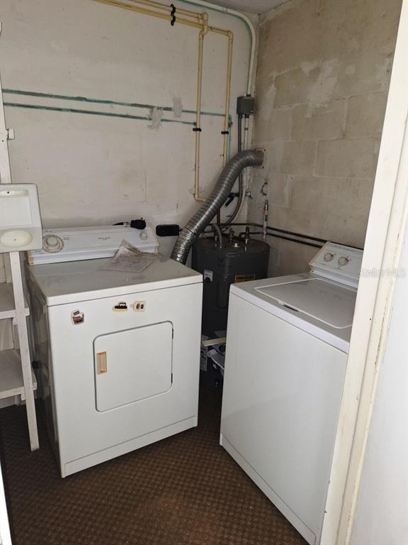9940 47th Avenue North, Unit 320 St. Petersburg, FL 33708 - Photo 23 of 23 a utility room with dryer and washer