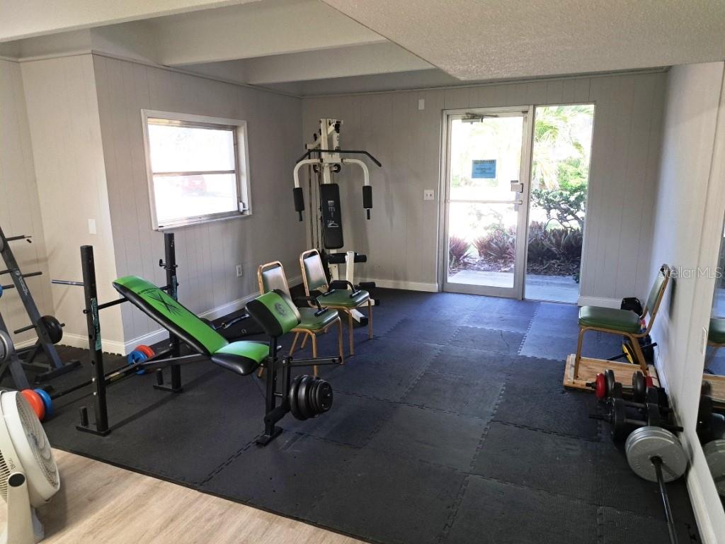 9940 47th Avenue North, Unit 320 St. Petersburg, FL 33708 - Photo 7 of 23 a view of a room with gym equipment