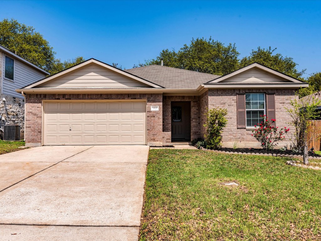 1513 Hawk Drive Cedar Park, TX 78613 - Photo 1 of 32 a front view of a house with a yard
