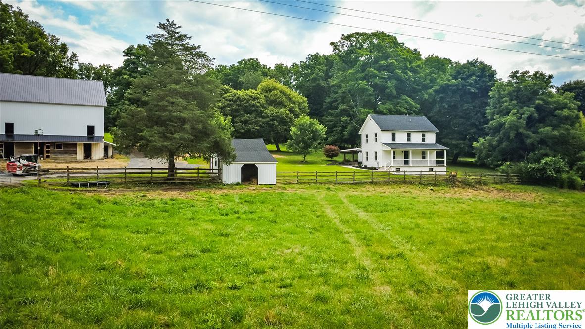 72 Allegheny Road Mount Bethel, PA 18343 - Photo 57 of 72 Rural charm abounds with a classic farmhouse, separate barn, and expansive green fields.