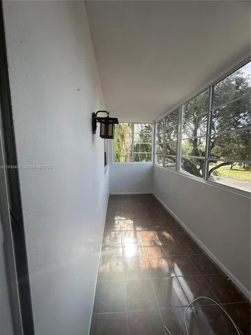 en empty room with windows