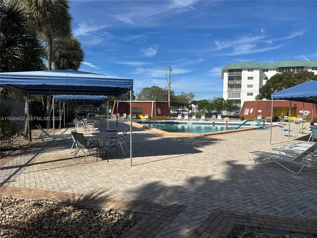 a view of a swimming pool with a patio