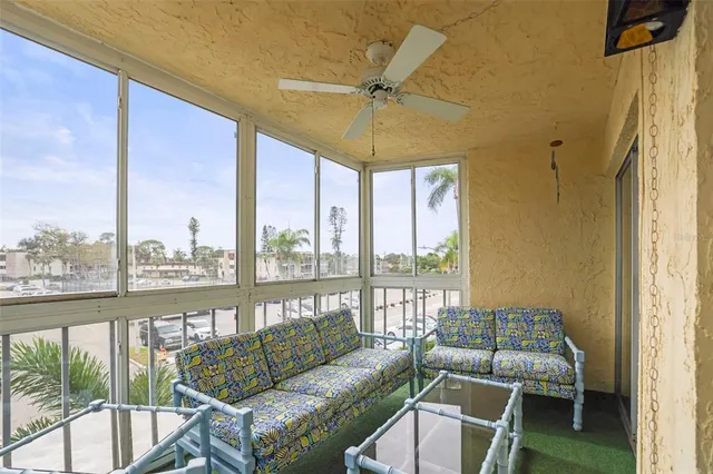 a living room with furniture and a floor to ceiling window