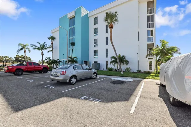 a view of a cars park in front of a house