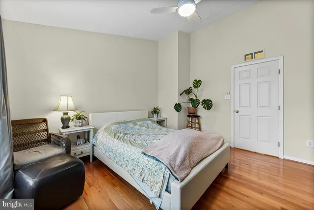 a bedroom with a bed and a television