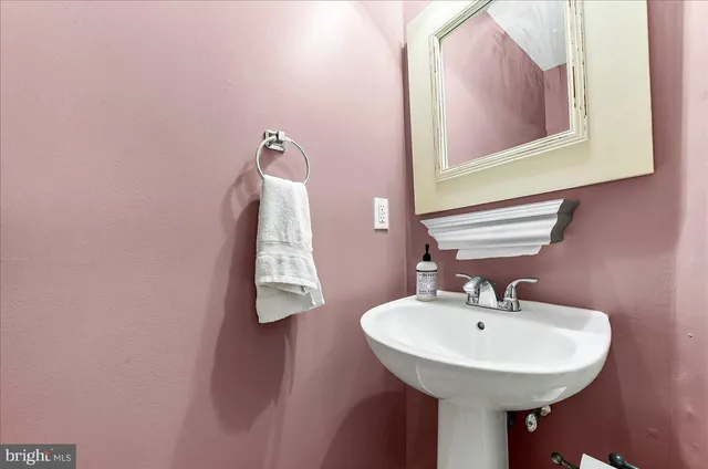 a bedroom with bed and a tv