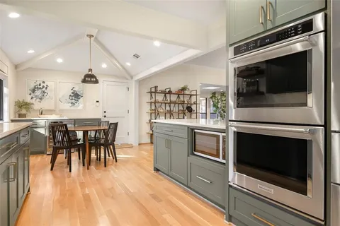 a kitchen with a stove and a microwave