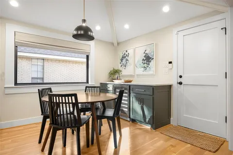 a view of a dining room with furniture and window